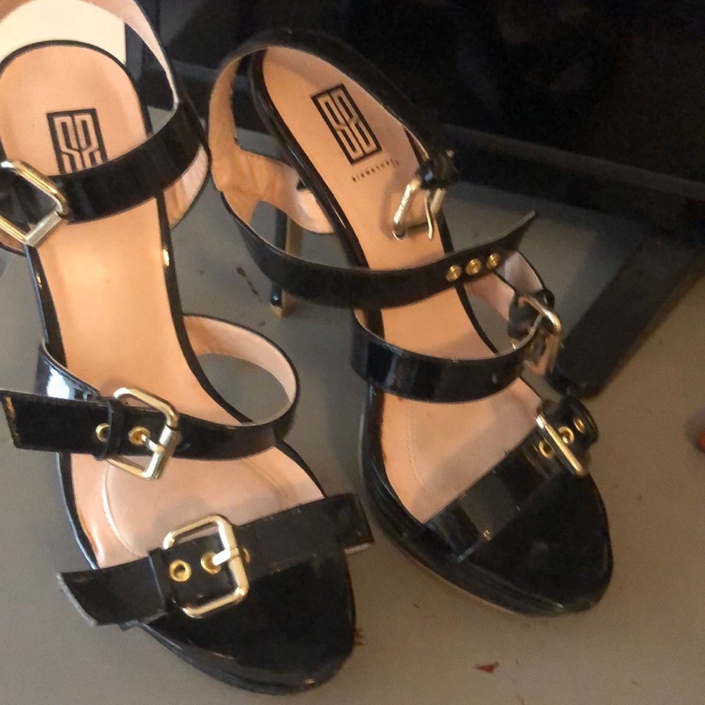 Black strappy heels, barely worn but with a couple knicks on the back heel